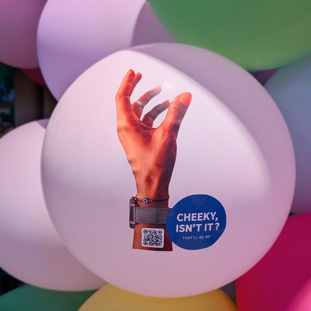 A campaign sticker on a balloon during the night