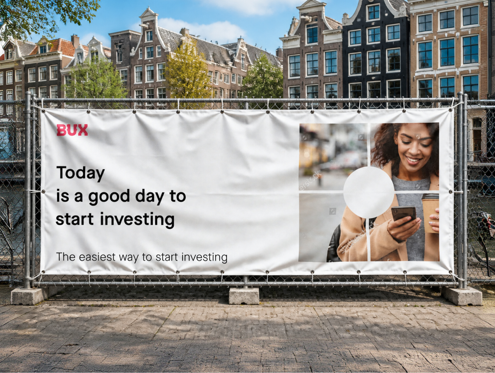 BUX 'today is a good day to start investing' banner on a fence by an Amsterdam canal